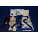 A quantity of Masonic regalia, aprons and collars.