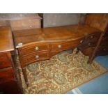 A reproduction cross-banded Mahogany Sideboard having one long and four short drawers and standing