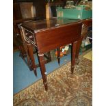 A Mahogany dropleaf Occasional Table having a drawer to one end and standing on turned and lobed