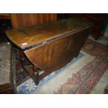 A fine and very heavy old Oak gateleg dropleaf Dining Table of late 17th c.