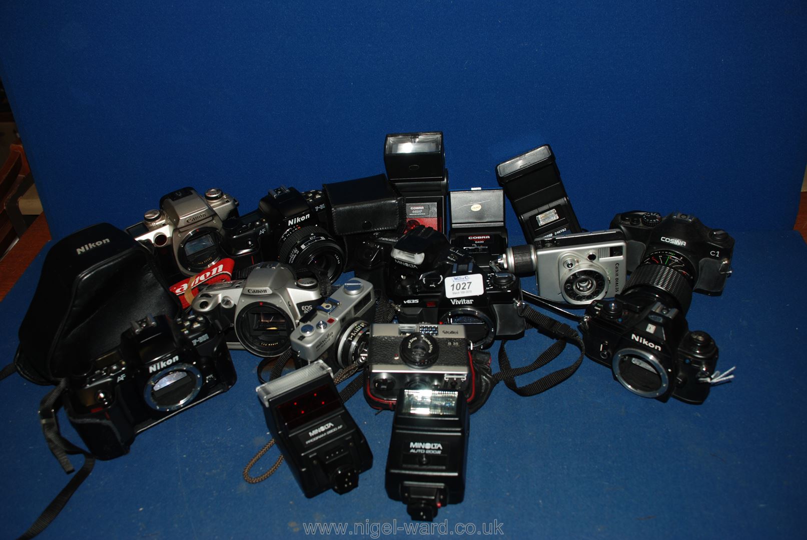 A large quantity of SLR film Cameras, lenses and flashes.