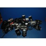 A large quantity of SLR film Cameras, lenses and flashes.