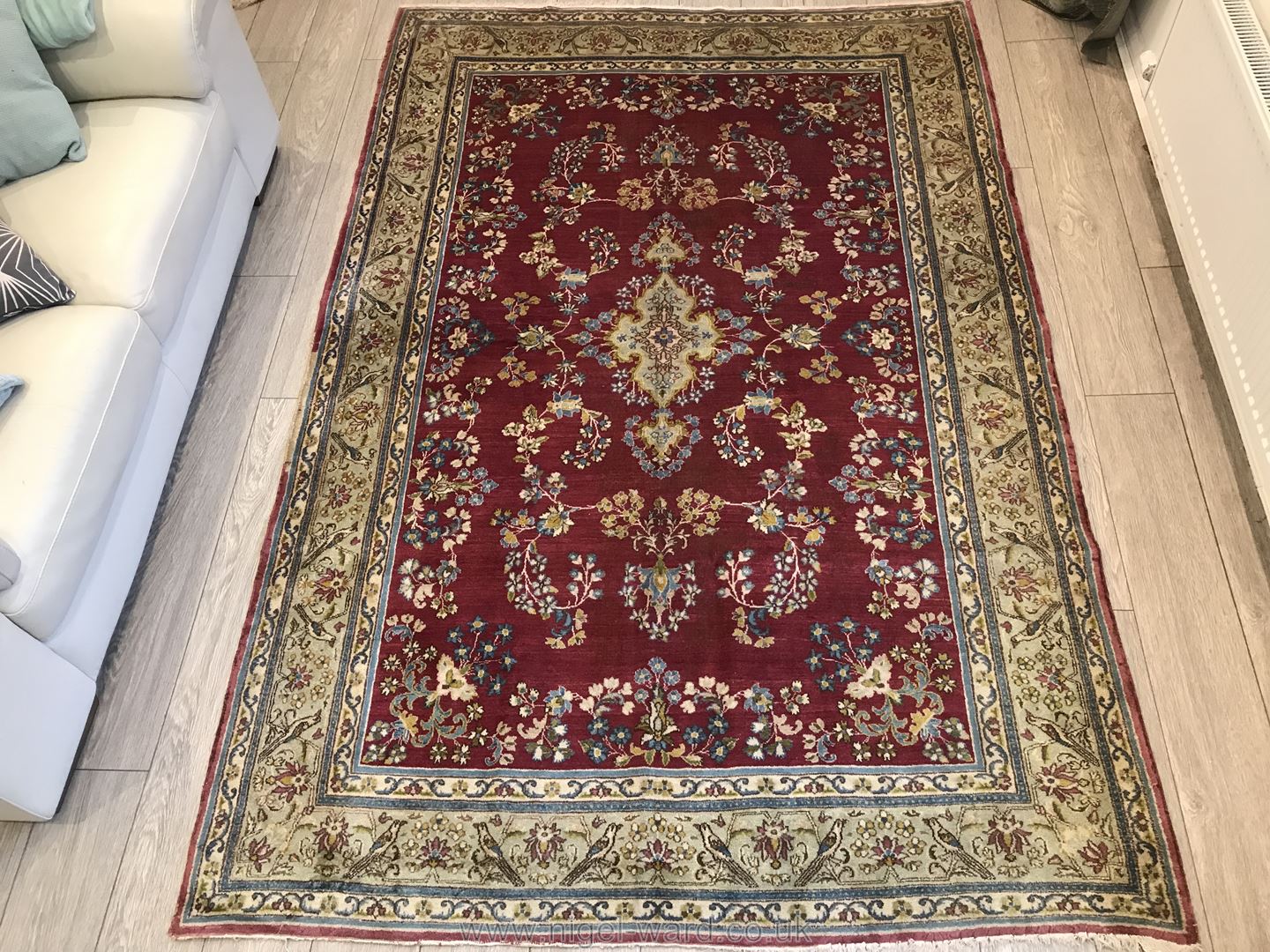 A hand-made Kerman Rug,