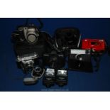 A box of cameras including Fuji film, Nikon Coolpix, Retina,