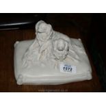 A Parian figure of two spaniels seated on cushion