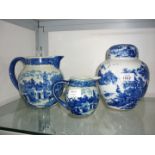 A blue and white lidded ginger Jar and two blue and white Jugs