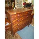 A Mahogany Chest of three long and two short Drawers having turned knobs and raised on splay