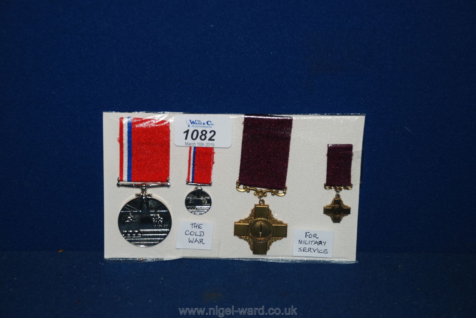 Two commemorative Medals with miniature medals ( The cold war and for Military service),
