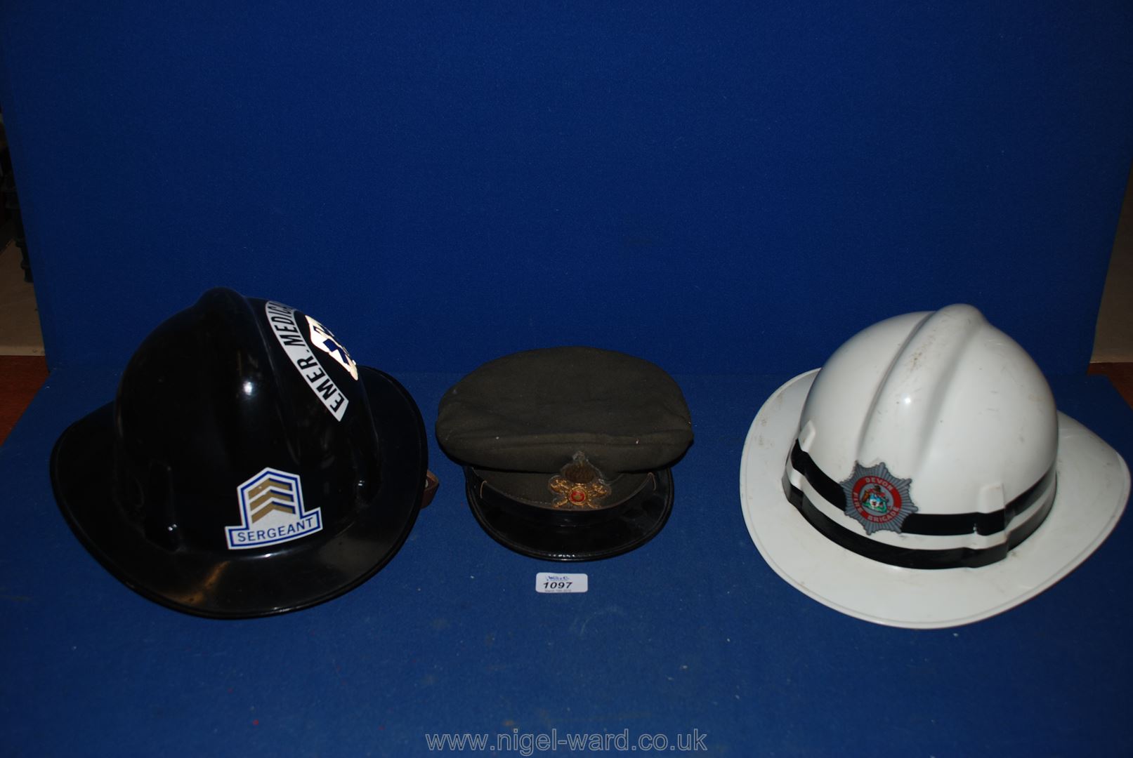 An Italian Fire Brigade peaked Cap with badge,