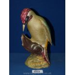 A Beswick matt 'Green woodpecker' (1218).