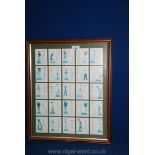 A framed set of Players golf cards.