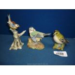 A boxed Beswick Goldcrest, a blue bird on a tree trunk,