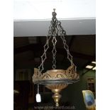 A heavy brass light fitting.