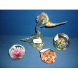 Three paperweights and a Murano style glass bird.