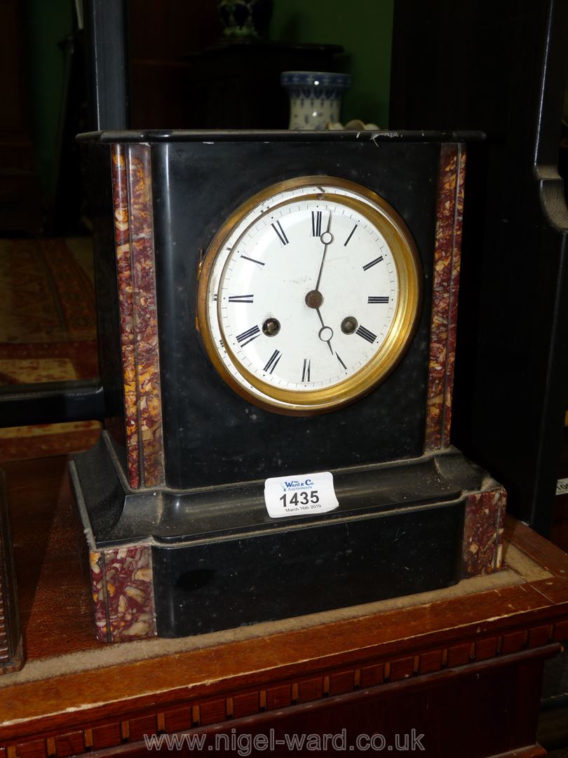 A black marble Mantle Clock