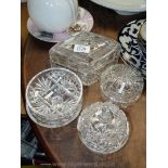 Four lidded glass jars/pots (three being circular,