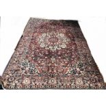 A large hand-made Kerman Carpet,