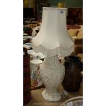 An embossed cream oriental style Table Lamp and shade
