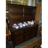 A dark Oak contemporary Dresser, the base with three cupboards and three frieze drawers,