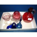 A small quantity of Cranberry glass, coloured glass jug, perfume bottles, etc.