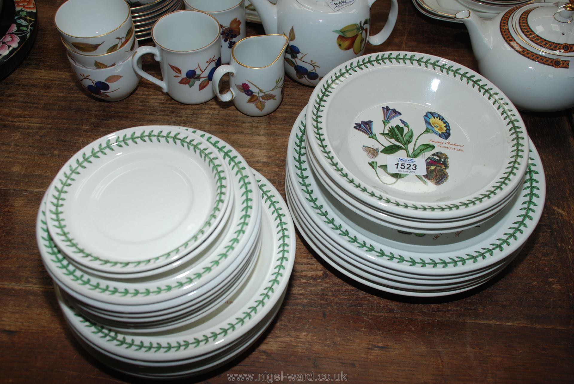 A quantity of Portmeirion "Botanic Garden" dinnerware including dinner, side and tea plates,