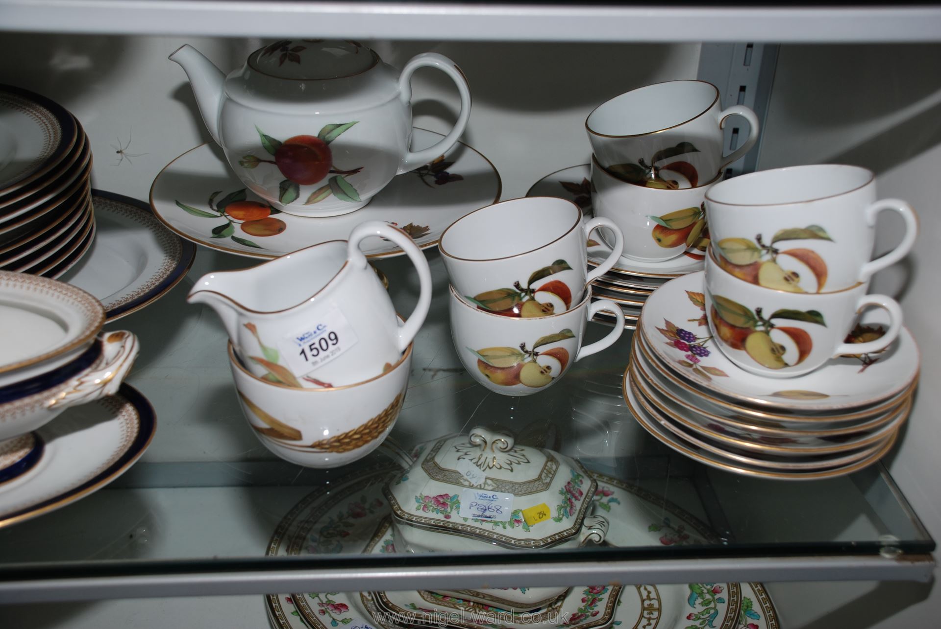 A Royal Worcester ''Evesham'' Teaset comprising six cups, saucers and tea plates and milk jug,