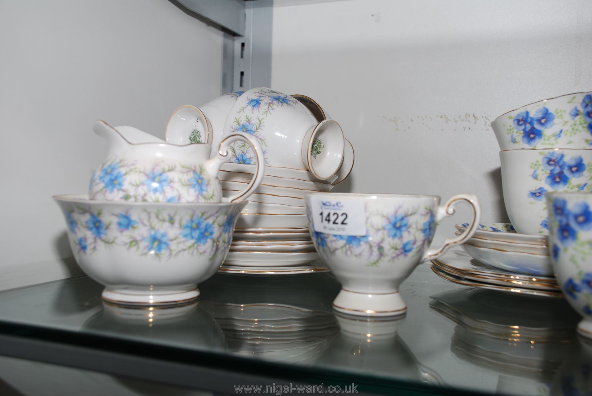 A Tuscan part tea set with blue flowers consisting of bread and butter plate, five tea plates,