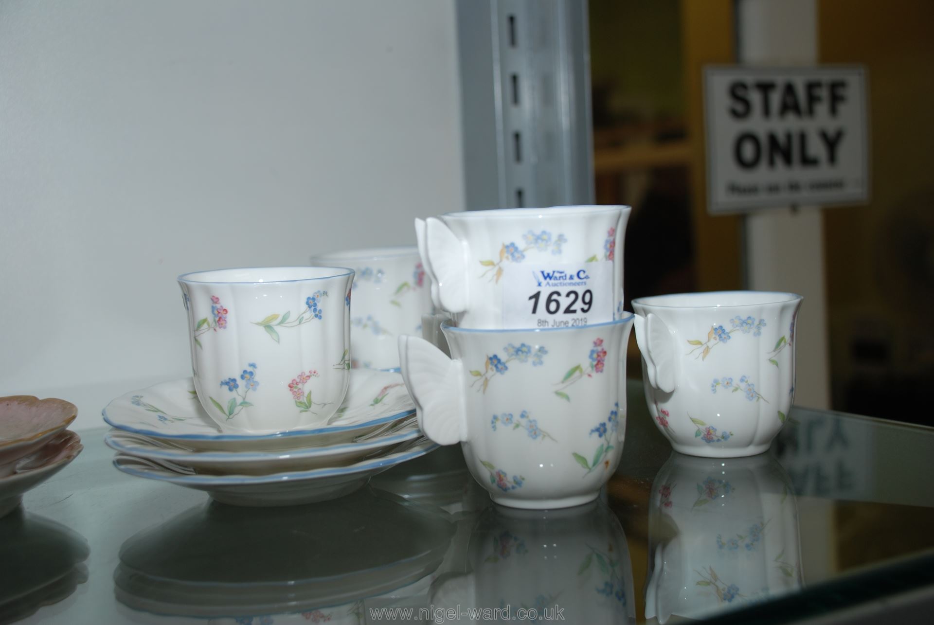 Six Royal Worcester 'Forget me not' Coffee cups and saucers with butterfly handles