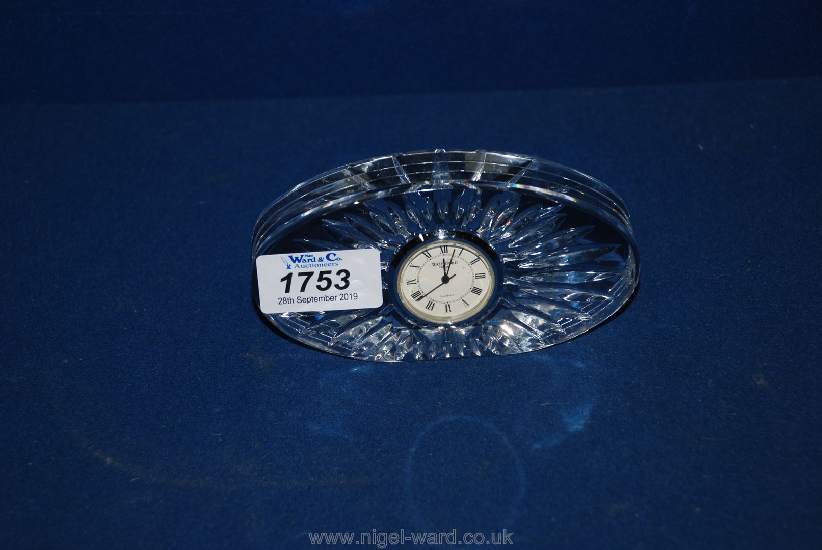 A Waterford crystal clock, 2 1/2" tall.