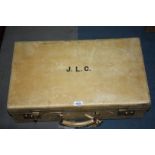 A cream Leather Suitcase