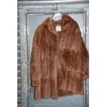 A light brown fur coat.