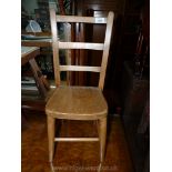 A very appealing child's small Chair of ladderback design with solid Elm seat,