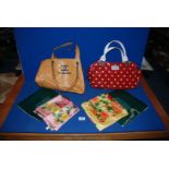Two boxed silk scarves and two handbags.