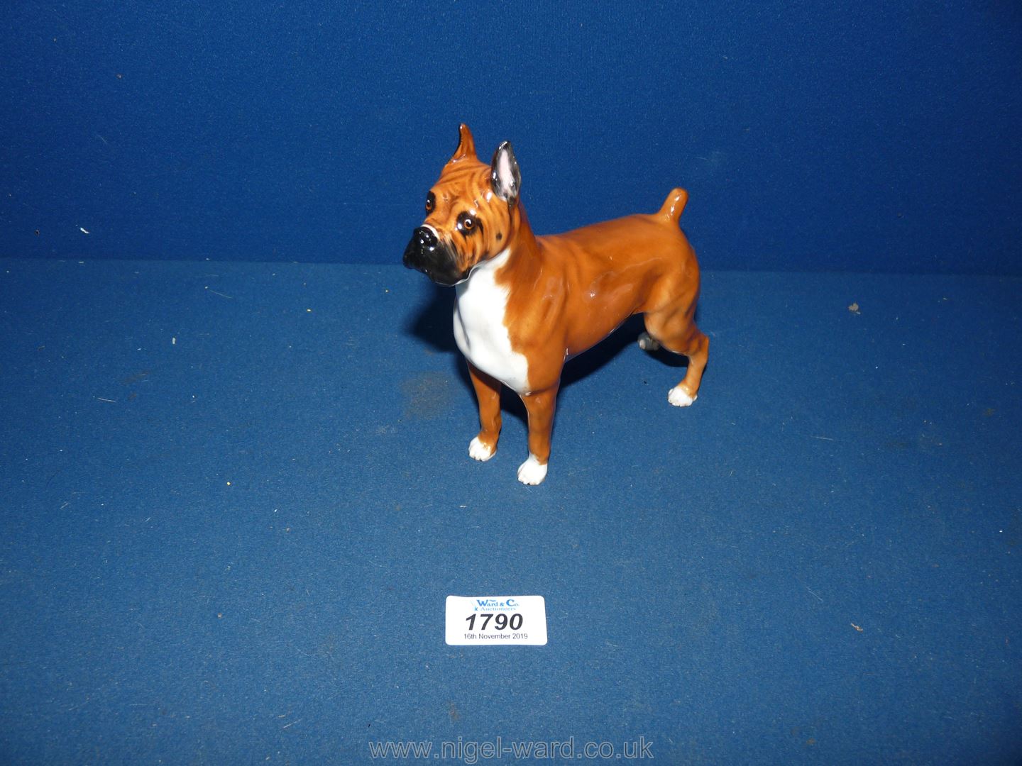 A Royal Doulton Boxer dog.