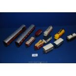 A quantity of Hornby 00 gauge wagons including The Royal Mail, Shell, Gulf, Birdseye, Smiths crisps,