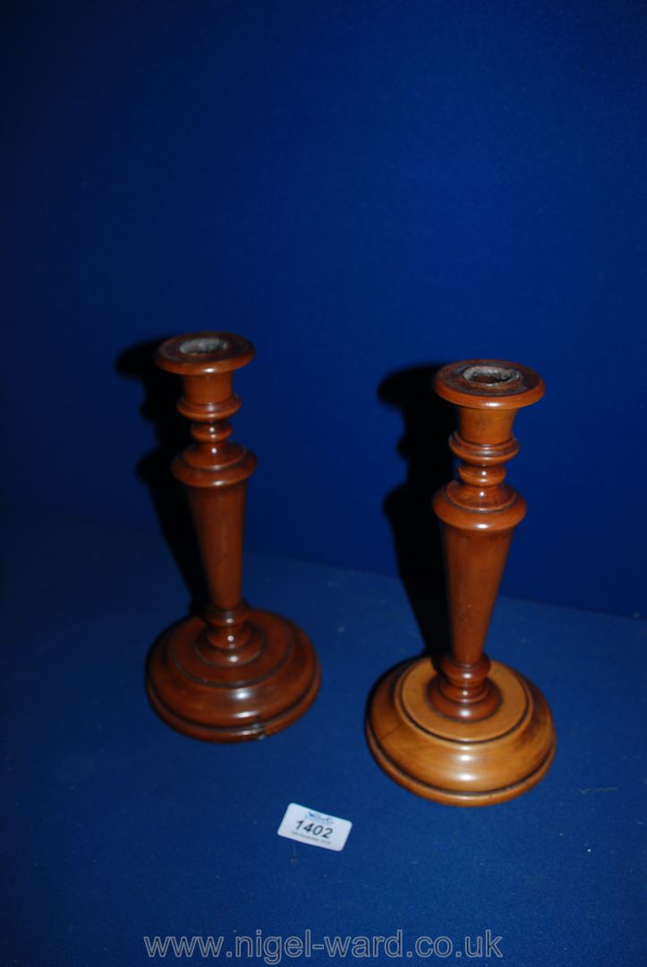 A pair of fruitwood Candlesticks.