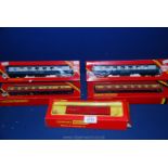 Five boxed Hornby 00 gauge carriages including Golden Arrow and track cleaning car.