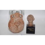 Antiquities: A good Roman terracotta flask with raised decoration of the Medusa head to each side