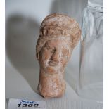 A Greek Tanagra terracotta head of a goddess, of excellent style, 4th century BC, unmounted.
