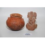 A bronze age terracotta mother and child figurine and a very early terracotta small bowl with