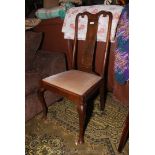 An Oak framed Queen Anne style side Chair having drop-in beige upholstered seat and standing on
