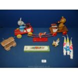 A box of vintage toys including two mice pull along on string.