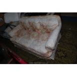 A shabby chic three seater Settee with loose covers