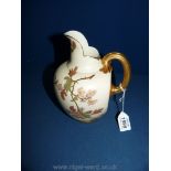 A large Royal Worcester porcelain blush ivory ovoid Jug with gilt highlighting spring blossom and