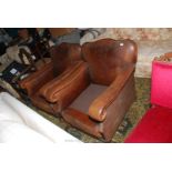 A pair of circa 1900/1910 brass studded leather upholstered gentleman's Club style easy Chairs,