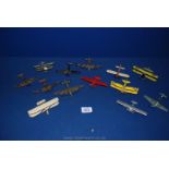 Thirteen small toy aeroplanes including NR-7952, K2572, Nx211.