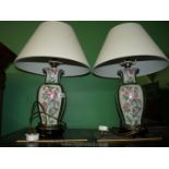 A pair of baluster shaped Table Lamps with floral panels edged in green/cream fabric shades.