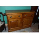 A contemporary Oak Sideboard by Timothy Hawkins of Bartestree having a pair of opposing raised and