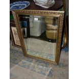 A bevel plated wall Mirror in ornate gilt colour.