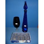 A tall blue glass chemists display Bottle,